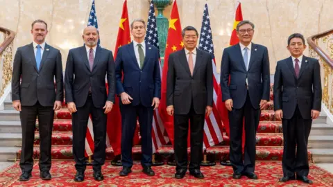 Getty Images US Treasury Secretary Scott Bessent and Chinese vice premier He Lifeng pose for a photo with US Trade Representative Jamieson Greer, US Secretary of Commerce Howard Lutnick, Chinese Commerce Minister Wang Wentao, and China's International Trade Representative and Vice Minister of Commerce Li Chenggang, in London on 9 June, 2025.