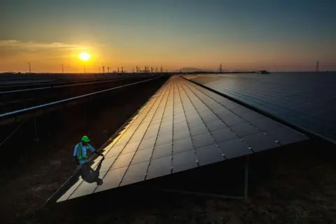 LightRocket via Getty Images  Gopalakrishna Devraj, is inspecting the solar panels at the Fortum solar park in Karnataka state that is one of indias bigest solar energy producers. According to the World Economic Forum, in 2020, India was home to six out of 10 of the world's most polluted cities. A majority of India's energy production comes from fossil fuels. (Photo by Jonas Gratzer/LightRocket via G