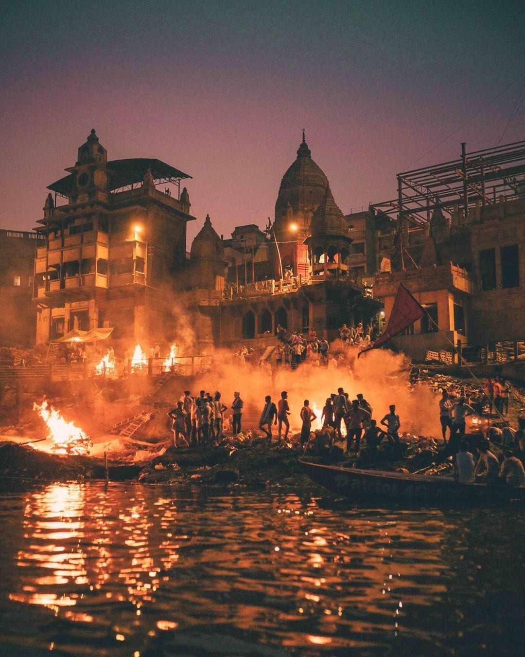 Manikarnika Ghat: Known as the "Gateway to Moksha," this burning ghat represents the eternal cycle of life and death. During Shivaratri, its spiritual energy is palpable as devotees pay respects to Mahadev, the lord of cremation grounds, amidst the glowing, never-extinguished funeral pyres. Manikarnika Ghat: Known as the "Gateway to Moksha," this burning ghat represents the eternal cycle of life and death. During Shivaratri, its spiritual energy is palpable as devotees pay respects to Mahadev, the lord of cremation grounds, amidst the glowing, never-extinguished funeral pyres.